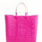 Hot pink woven bucket bag made from recycled plastics featuring a white leather handle