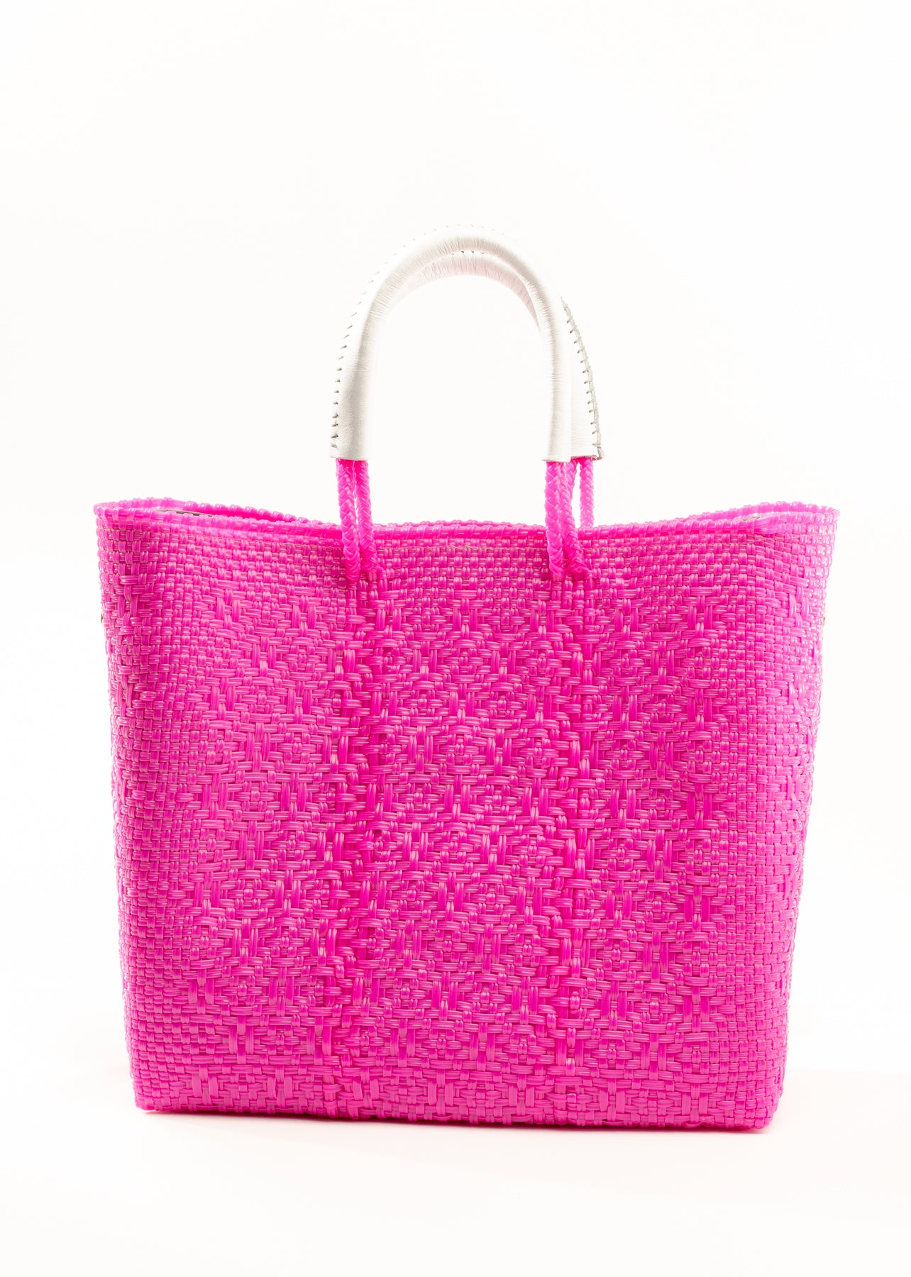 Hot pink woven bucket bag made from recycled plastics featuring a white leather handle
