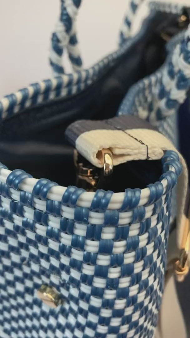 Video of blue and white chevron bag with blue and white striped strap